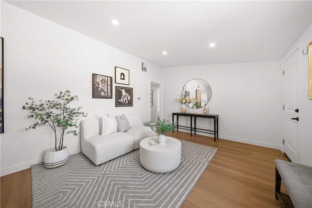 12391 Beck Ave, Garden Grove, CA 92840 - living room with wood finished floors, recessed lighting, and baseboards