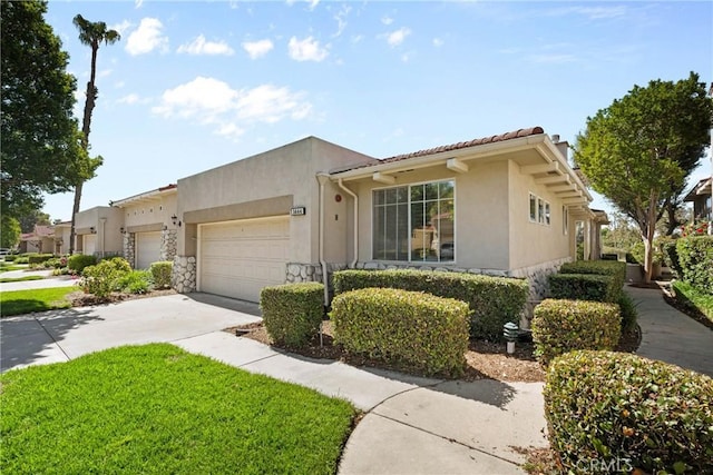 1444 Upland Hills Dr N, Upland, CA 91784 - view of front facade featuring an attached garage, driveway, and stucco siding