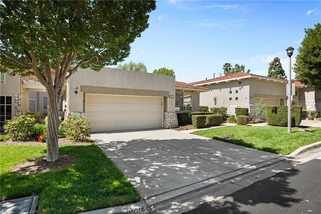 1444 Upland Hills Dr N, Upland, CA 91784 - view of front of house featuring stone siding, a garage, concrete driveway, and stucco siding