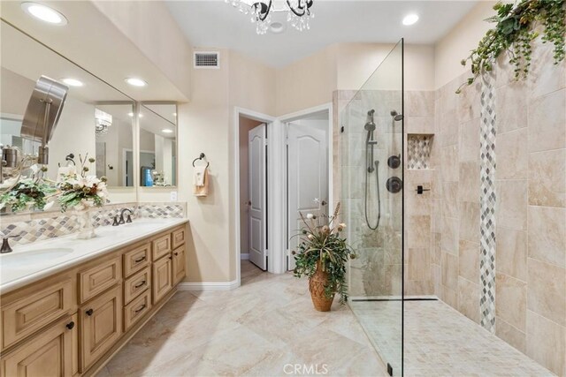 1444 Upland Hills Dr N, Upland, CA 91784 - bathroom with double vanity, a walk in shower, recessed lighting, a chandelier, and tasteful backsplash