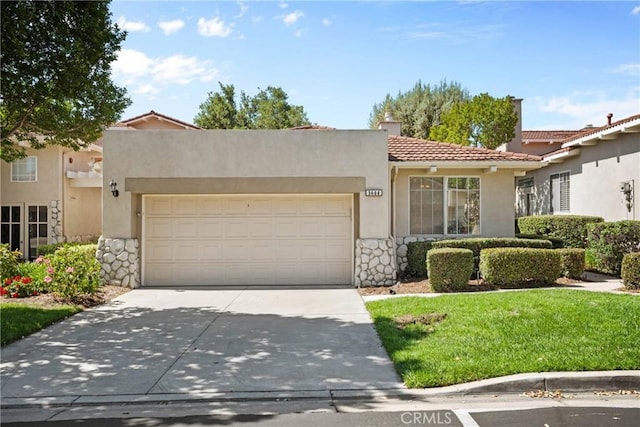 1444 Upland Hills Dr N, Upland, CA 91784 - view of front of property featuring a tile roof, driveway, an attached garage, stucco siding, and a front lawn