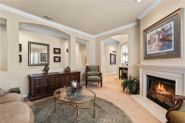 1444 Upland Hills Dr N, Upland, CA 91784 - living area featuring carpet flooring, ornamental molding, arched walkways, a glass covered fireplace, and baseboards