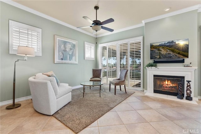 1444 Upland Hills Dr N, Upland, CA 91784 - sitting room featuring crown molding, tile patterned floors, ceiling fan, baseboards, and a glass covered fireplace