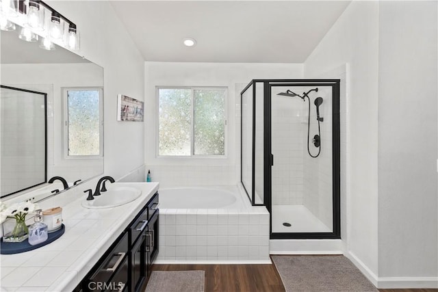 42276 Camino Merano, Temecula, CA 92592 - full bath with a bath, a stall shower, double vanity, and wood finished floors