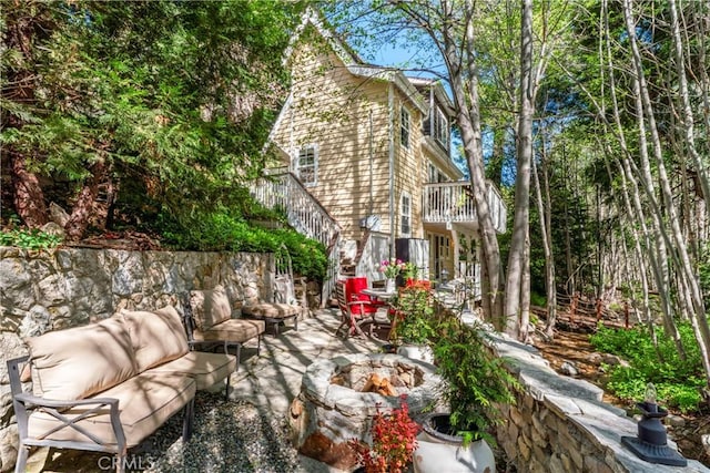 29613 Hook Creek Rd, Cedar Glen, CA 92321 - view of patio featuring an outdoor living space with a fire pit, stairs, and a balcony