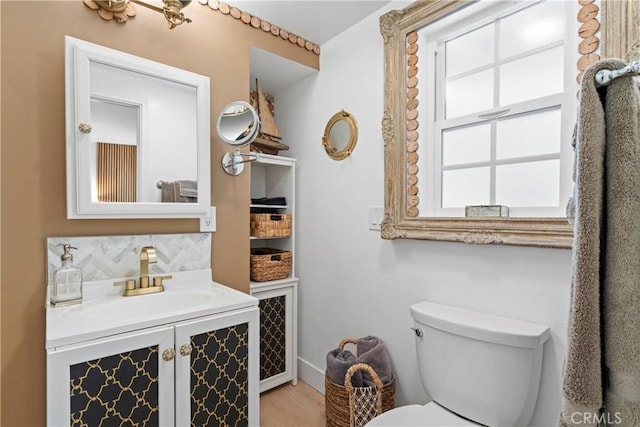 29613 Hook Creek Rd, Cedar Glen, CA 92321 - bathroom featuring vanity, decorative backsplash, toilet, and wood finished floors