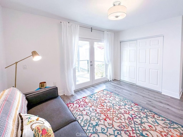 1927 W 84th Pl, Los Angeles, CA 90047 - sitting room with french doors, wood finished floors, and baseboards