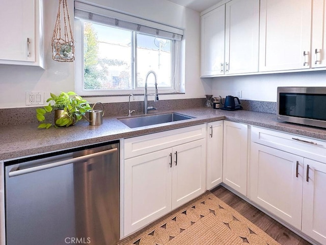 1927 W 84th Pl, Los Angeles, CA 90047 - kitchen featuring appliances with stainless steel finishes, a sink, and white cabinets