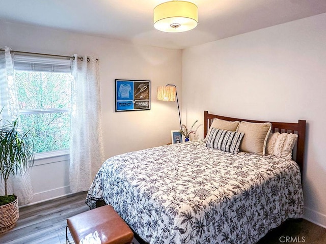 1927 W 84th Pl, Los Angeles, CA 90047 - bedroom featuring wood finished floors and baseboards