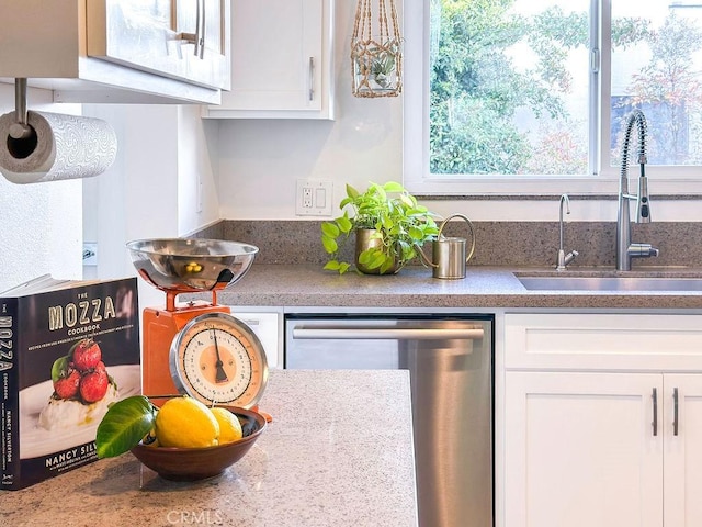 1927 W 84th Pl, Los Angeles, CA 90047 - kitchen with dishwasher, a sink, and white cabinets