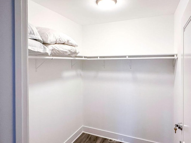 1927 W 84th Pl, Los Angeles, CA 90047 - walk in closet featuring dark wood-type flooring