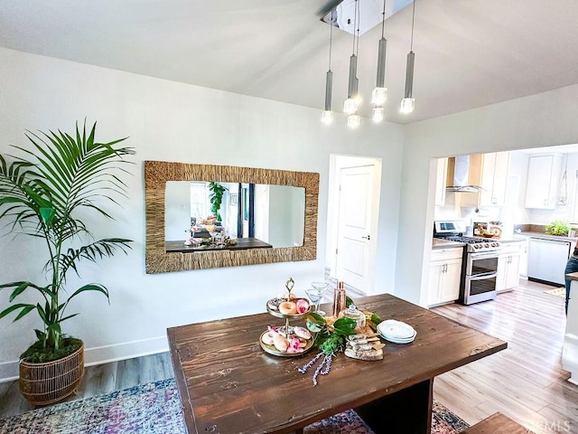 1927 W 84th Pl, Los Angeles, CA 90047 - dining room with light wood-type flooring, a chandelier, and baseboards