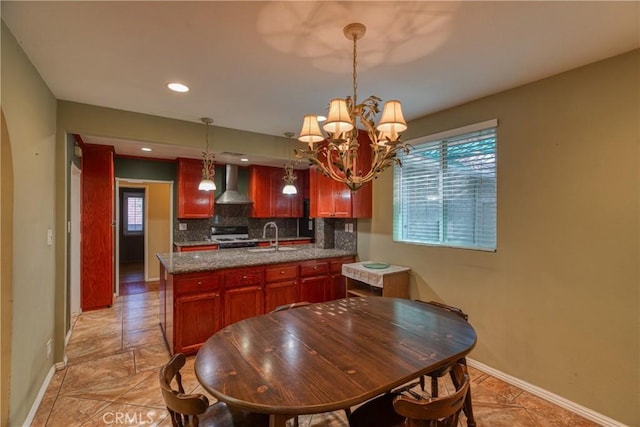 10049 Langdon, Mission Hills San Fernando, CA 91345 - kitchen with wall chimney exhaust hood, a chandelier, backsplash, white range, and pendant lighting