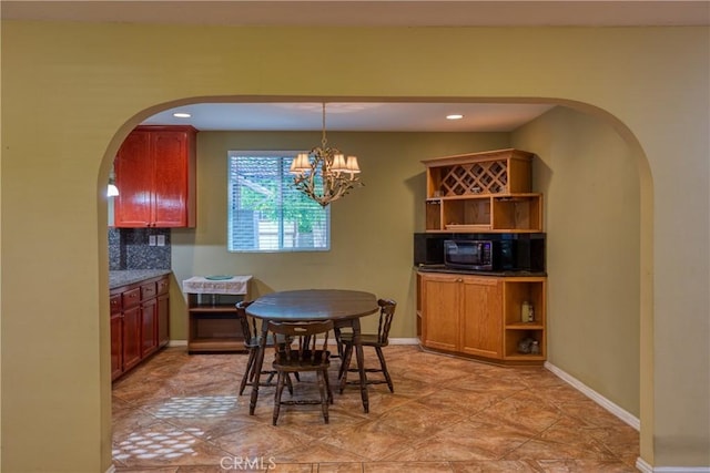10049 Langdon, Mission Hills San Fernando, CA 91345 - dining area with arched walkways, a chandelier, and recessed lighting