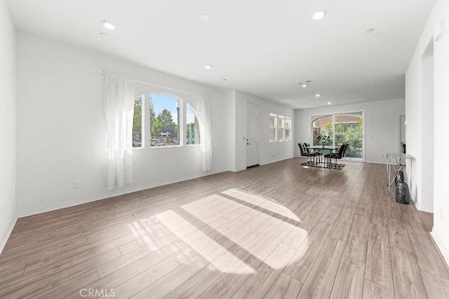 16075 Osprey Ave, Chino, CA 91708 - unfurnished living room with light wood-style flooring, recessed lighting, and baseboards