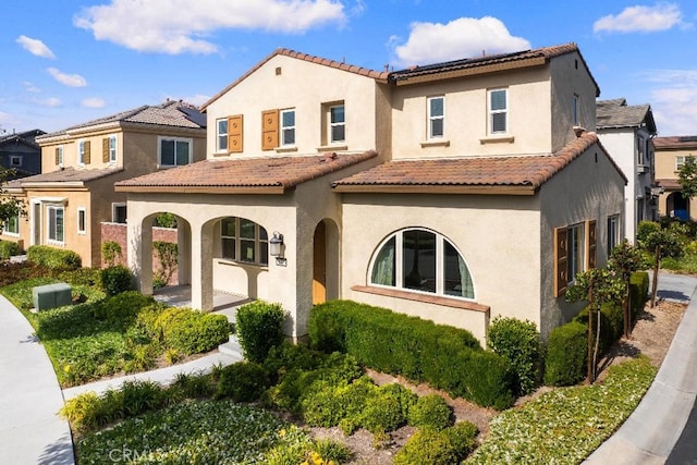 16075 Osprey Ave, Chino, CA 91708 - mediterranean / spanish-style house featuring stucco siding, a tiled roof, and a residential view