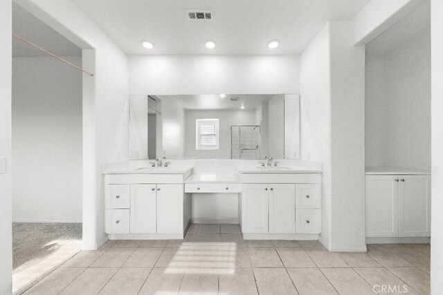 16075 Osprey Ave, Chino, CA 91708 - bathroom featuring a stall shower, tile patterned flooring, vanity, and recessed lighting
