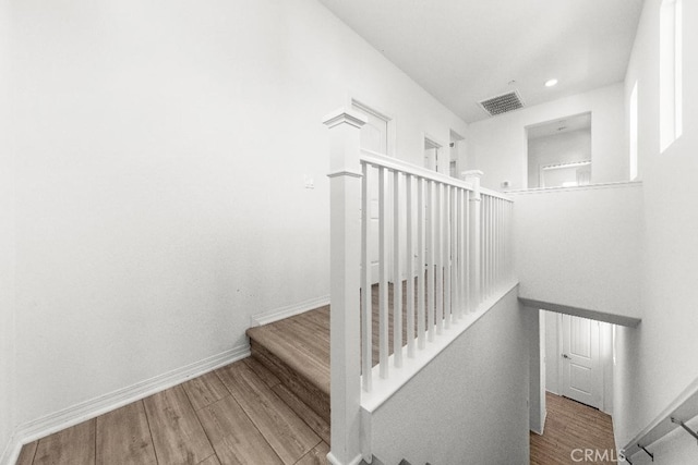 16075 Osprey Ave, Chino, CA 91708 - stairs with wood finished floors, baseboards, and recessed lighting