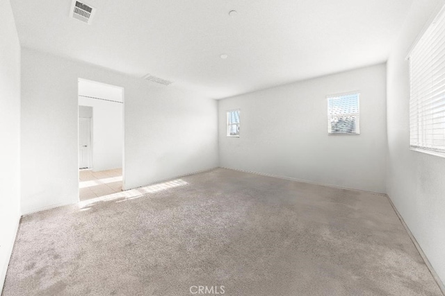 16075 Osprey Ave, Chino, CA 91708 - empty room featuring healthy amount of natural light and carpet