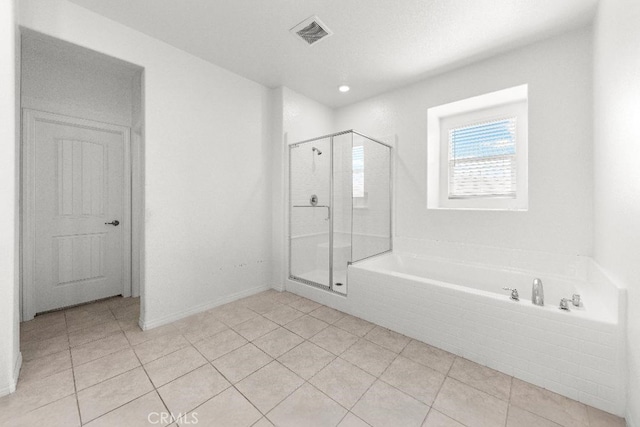 16075 Osprey Ave, Chino, CA 91708 - full bathroom with tile patterned floors, a shower stall, and a garden tub
