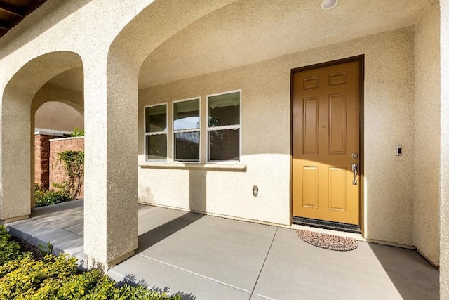 16075 Osprey Ave, Chino, CA 91708 - doorway to property featuring stucco siding and a patio area