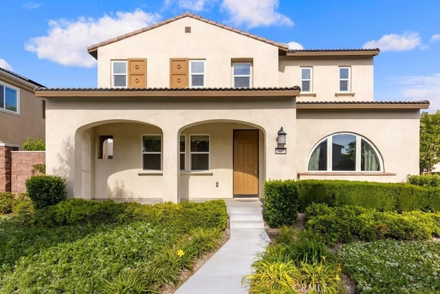 16075 Osprey Ave, Chino, CA 91708 - mediterranean / spanish-style house with stucco siding and a porch