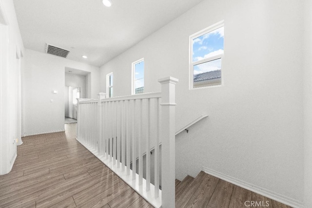 16075 Osprey Ave, Chino, CA 91708 - hall with an upstairs landing, wood finished floors, recessed lighting, and baseboards
