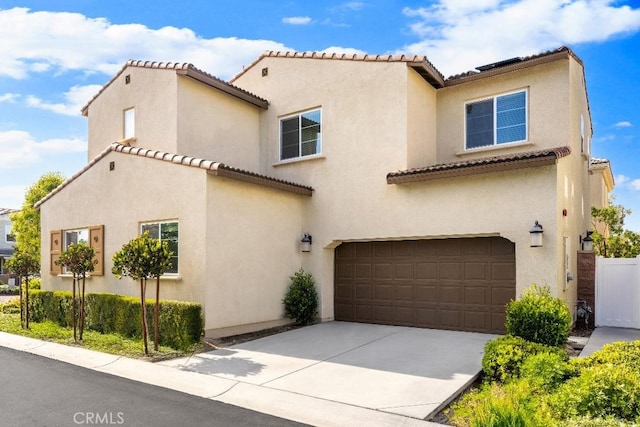 16075 Osprey Ave, Chino, CA 91708 - mediterranean / spanish-style house with a tile roof, a garage, stucco siding, and concrete driveway