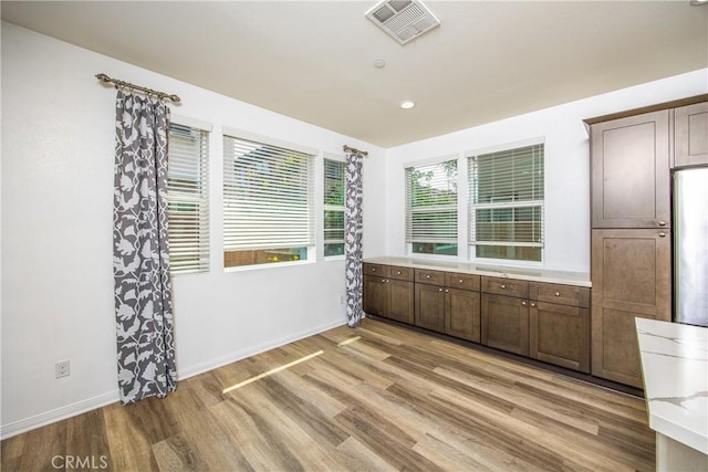1438 Madrid Dr, Pomona, CA 91766 - unfurnished dining area featuring light wood finished floors and baseboards