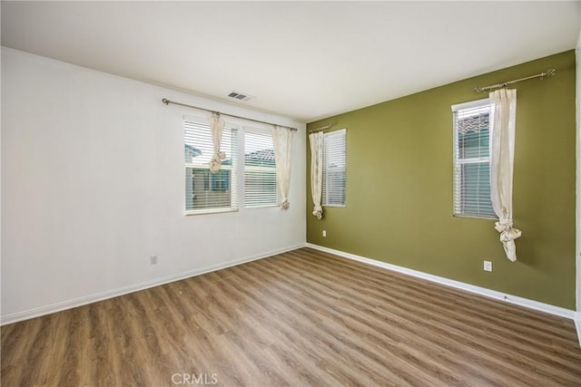 1438 Madrid Dr, Pomona, CA 91766 - unfurnished room with wood finished floors and baseboards