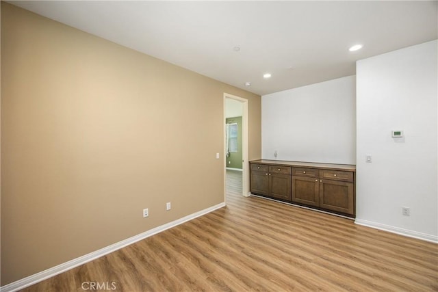 1438 Madrid Dr, Pomona, CA 91766 - unfurnished room featuring light wood-style floors, baseboards, and recessed lighting