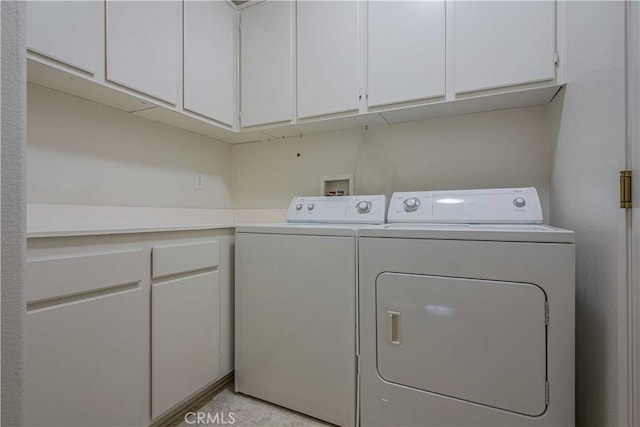 28044 Oakhaven Ln, Menifee, CA 92584 - washroom with washer and clothes dryer and cabinet space