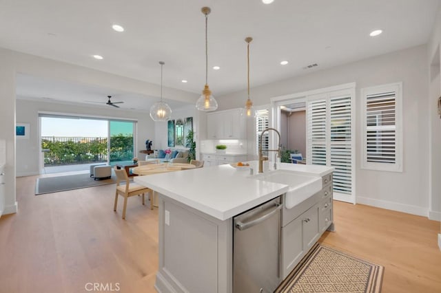 6888 Copper Creek Pl, Moorpark, CA 93021 - kitchen featuring dishwasher, a sink, open floor plan, recessed lighting, and light wood-type flooring