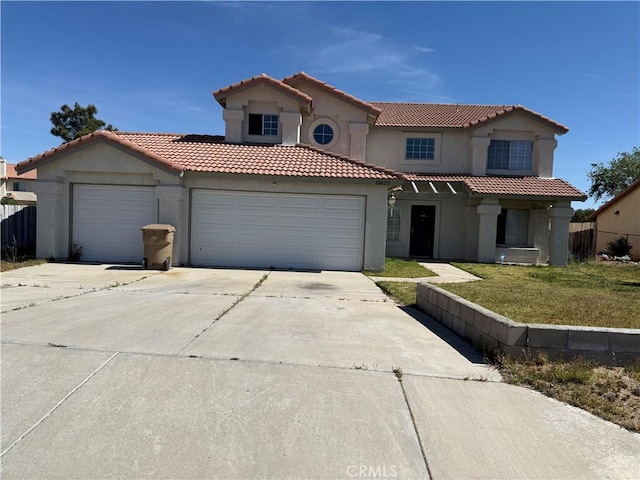 15620 Smoke Tree St, Hesperia, CA 92345 - mediterranean / spanish-style house featuring stucco siding, concrete driveway, an attached garage, a tiled roof, and a front lawn