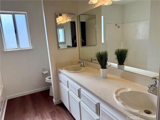 15620 Smoke Tree St, Hesperia, CA 92345 - full bath featuring wood finished floors, double vanity, a bath, and a shower