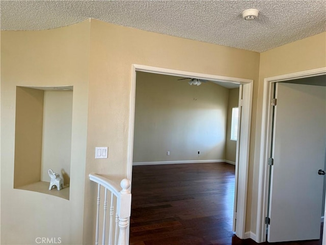 15620 Smoke Tree St, Hesperia, CA 92345 - hallway with a textured ceiling and dark wood-style flooring