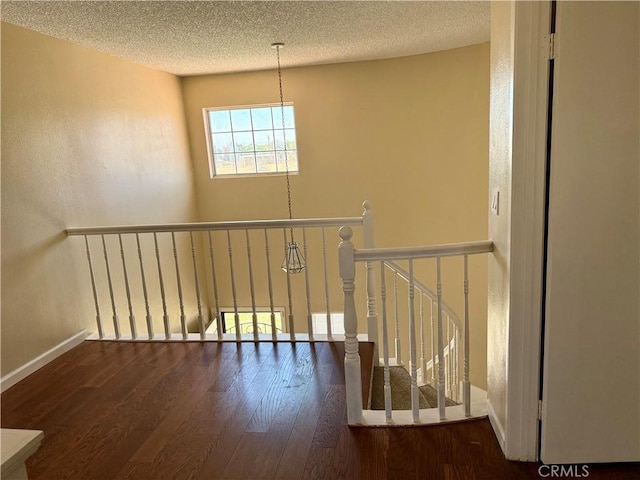 15620 Smoke Tree St, Hesperia, CA 92345 - stairway featuring wood finished floors and a textured ceiling