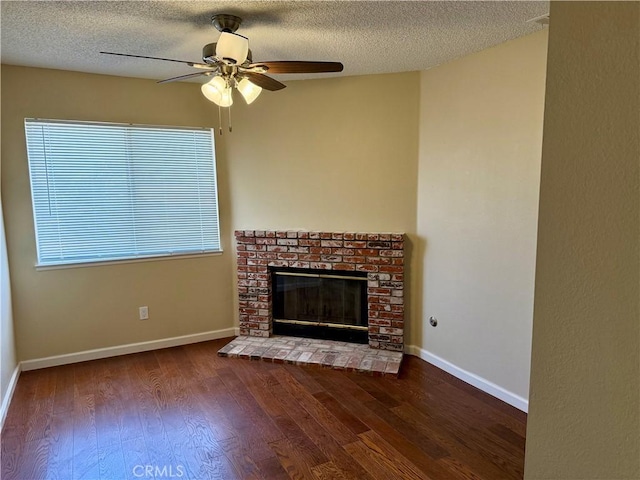 15620 Smoke Tree St, Hesperia, CA 92345 - unfurnished living room with wood finished floors, a brick fireplace, ceiling fan, and a textured ceiling