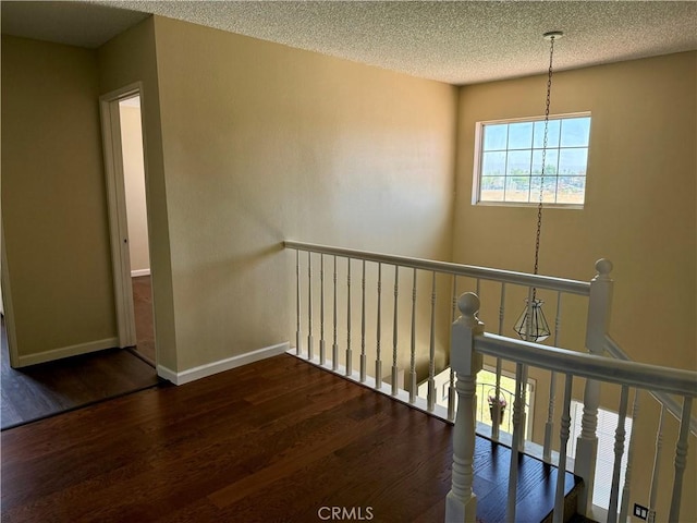 15620 Smoke Tree St, Hesperia, CA 92345 - hall featuring an upstairs landing, wood finished floors, and a textured ceiling