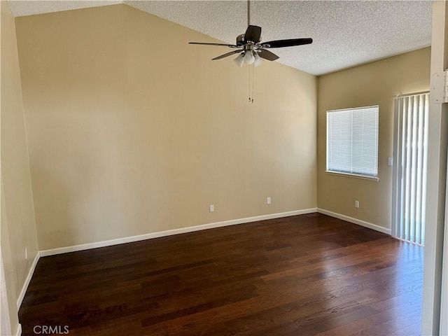 15620 Smoke Tree St, Hesperia, CA 92345 - spare room with dark wood-type flooring, ceiling fan, a textured ceiling, and lofted ceiling