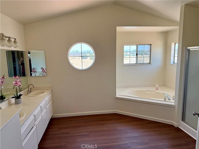15620 Smoke Tree St, Hesperia, CA 92345 - full bath featuring wood finished floors, double vanity, a shower stall, a bath, and vaulted ceiling
