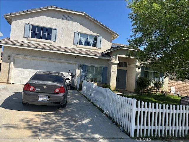 1761 Blackberry Ct, Palmdale, CA 93551 - view of front of house with stucco siding, a garage, driveway, and a tiled roof