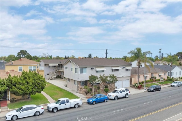 4426 N Lakewood Blvd, Long Beach, CA 90808 - view of front of home with a residential view and an attached garage