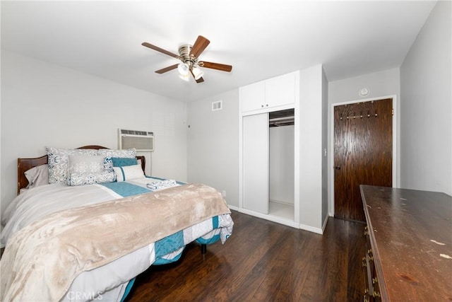 261 E Fig Ave, Monrovia, CA 91016 - bedroom featuring dark wood-style flooring, a closet, a wall mounted AC, baseboards, and ceiling fan