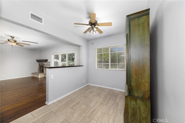 261 E Fig Ave, Monrovia, CA 91016 - empty room with ceiling fan, wood finished floors, and baseboards