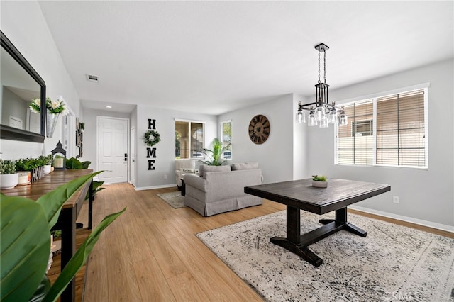27286 Wedgewood Way, Murrieta, CA 92562 - living area with wood finished floors, baseboards, and a chandelier