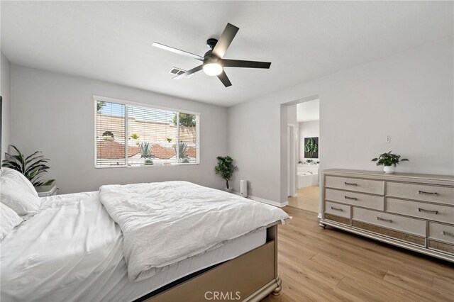 27286 Wedgewood Way, Murrieta, CA 92562 - bedroom featuring light wood-style flooring, connected bathroom, ceiling fan, and baseboards