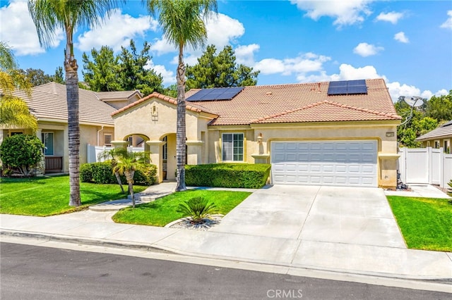 27286 Wedgewood Way, Murrieta, CA 92562 - mediterranean / spanish-style house with a tiled roof, stucco siding, a garage, concrete driveway, and solar panels