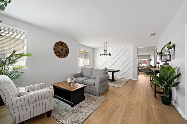 27286 Wedgewood Way, Murrieta, CA 92562 - living room with light wood finished floors, a chandelier, and baseboards