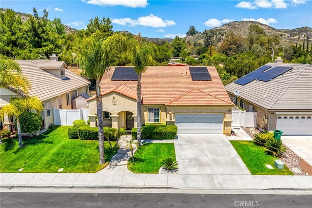 27286 Wedgewood Way, Murrieta, CA 92562 - mediterranean / spanish house with a tiled roof, stucco siding, driveway, a garage, and roof mounted solar panels